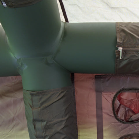 Air beam junction inside the army green Cabin tent.