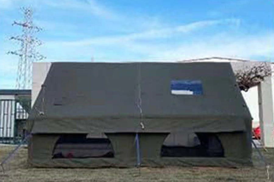 Side view of an army green Cabin tent showing the skylight and vents