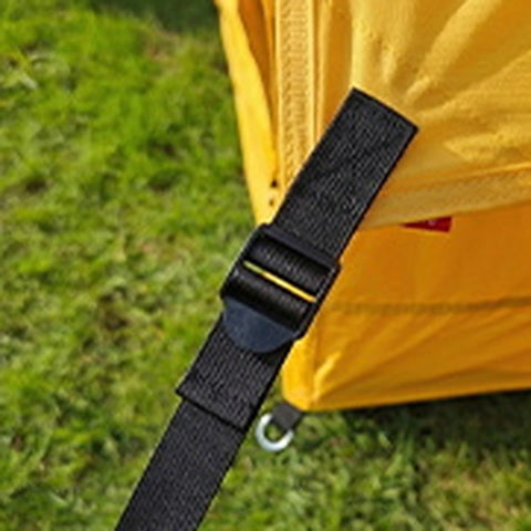 Guyline attachment strap on the yellow Cabin tent