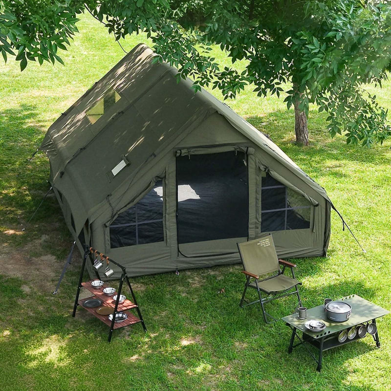Senleeto green inflatable glamping tent with rainfly in a forest. Ideal 4-season heavy-duty outdoor camping tent.
