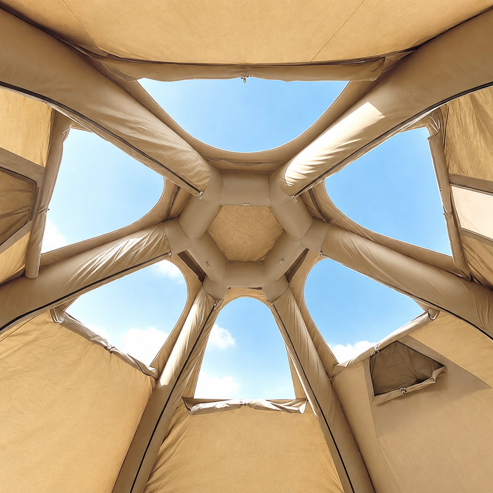 Six separate skylights around the central air-beam crown inside the olive green Dome tent.