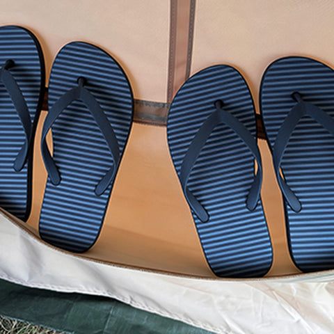 Sandals in the khaki tent wall storage pocket