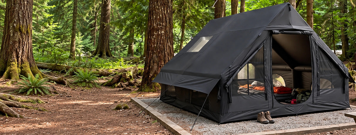 Black Cabin 13 x 10 tent pitched at a woodland campsite