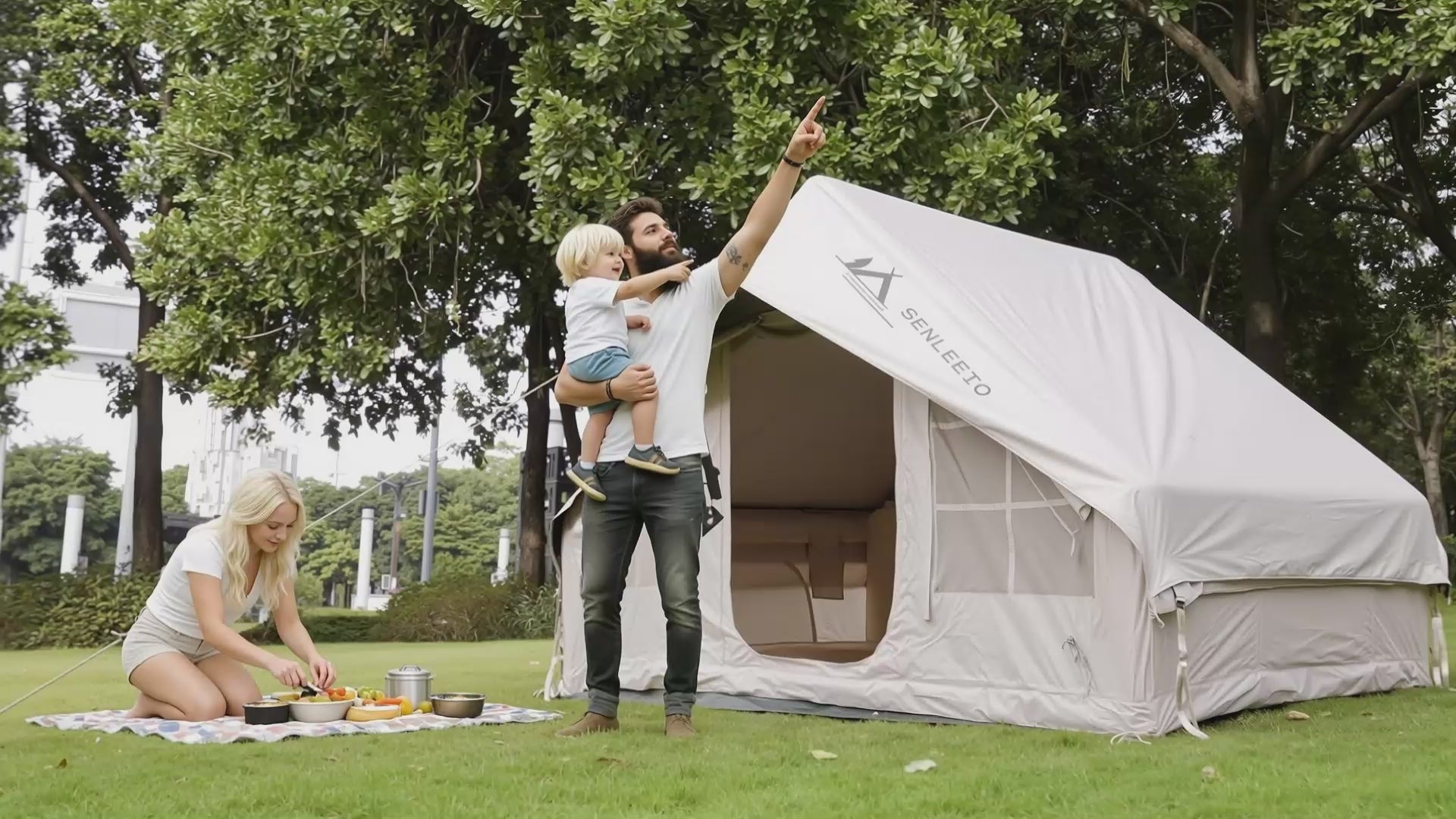 Senleeto 129 square feet large inflatable cabin tent pitched on grass. Quick setup waterproof glamping tent.