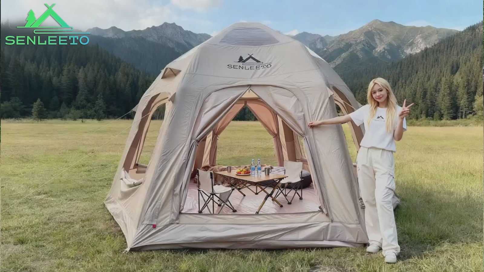 Watch a real-world couple enjoying a relaxing glamping experience in a sprawling dry grassland setting with the spacious Senleeto inflatable dome tent, their dog, and outdoor furniture.