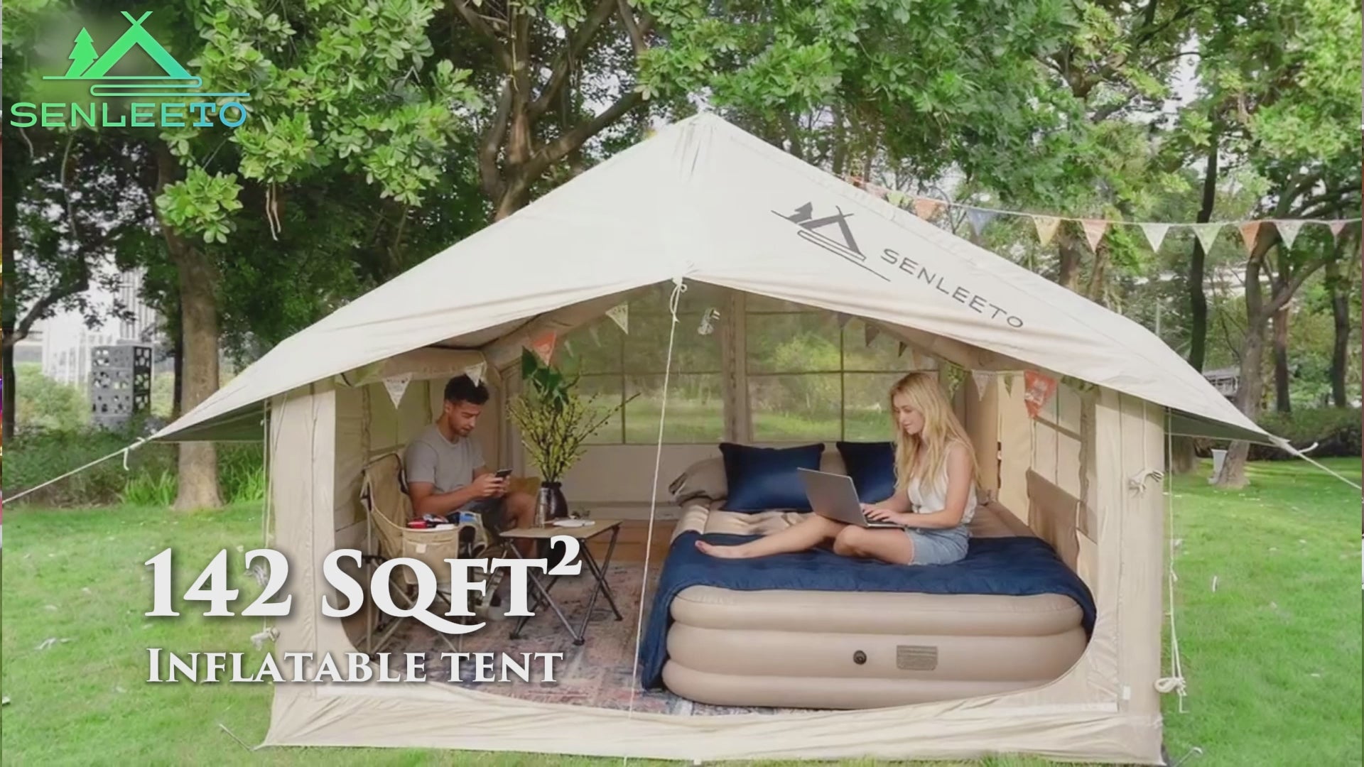 Senleeto 129 square feet large inflatable cabin tent pitched on grass. Quick setup waterproof glamping tent.