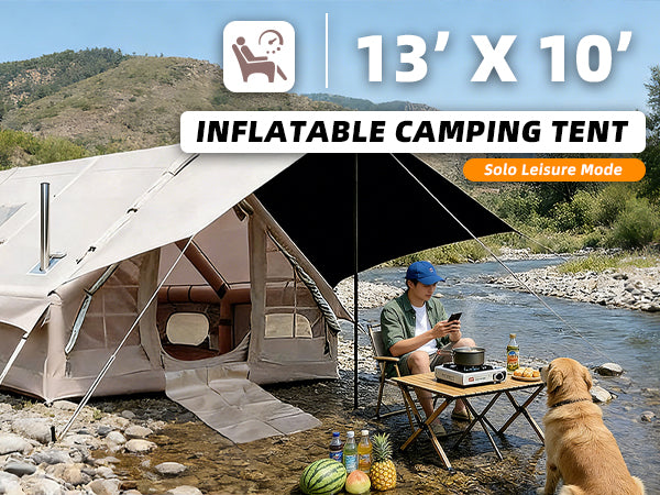Senleeto 13x10 inflatable camping tent pitched by a river on a sunny day, with a camper and a dog relaxing under the awning.