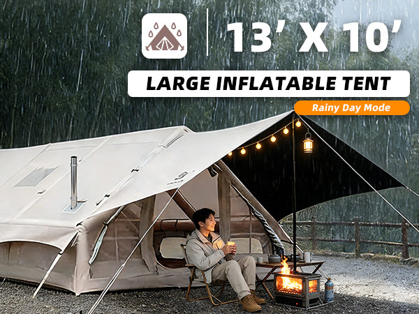 Senleeto 13x10 large inflatable tent during a rainy day, showing a camper staying dry under the front canopy with a fire pit
