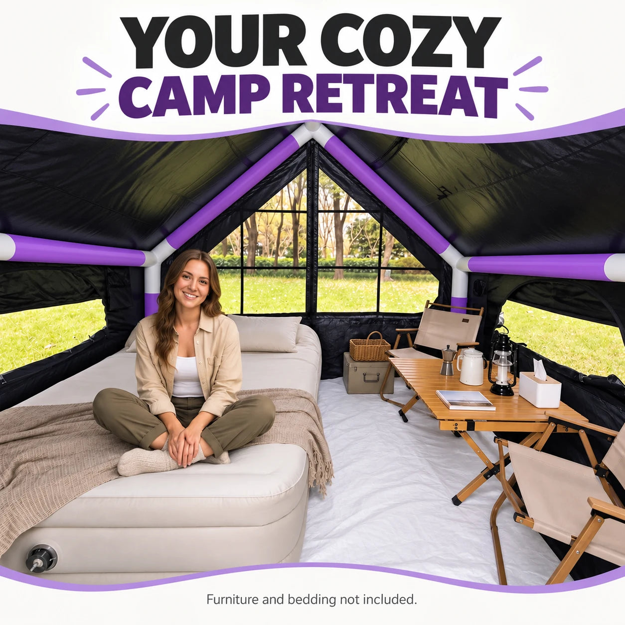 A camper relaxing on an air bed inside the purple cabin tent, with camping chairs and a table.