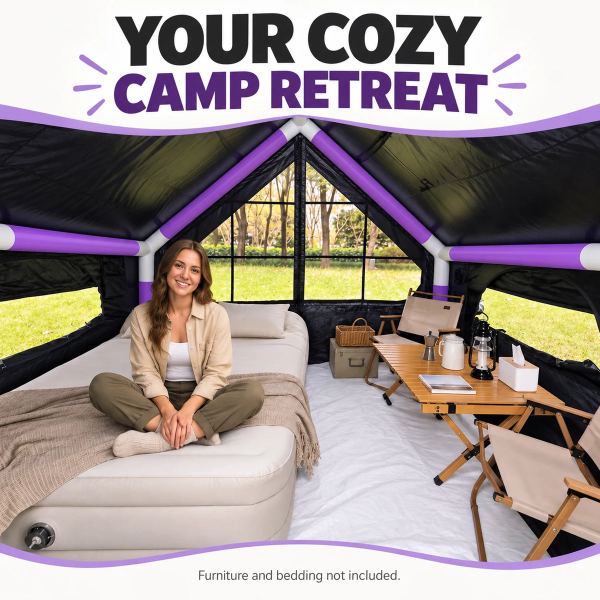 A camper relaxing on an air bed inside the purple cabin tent, with camping chairs and a table.