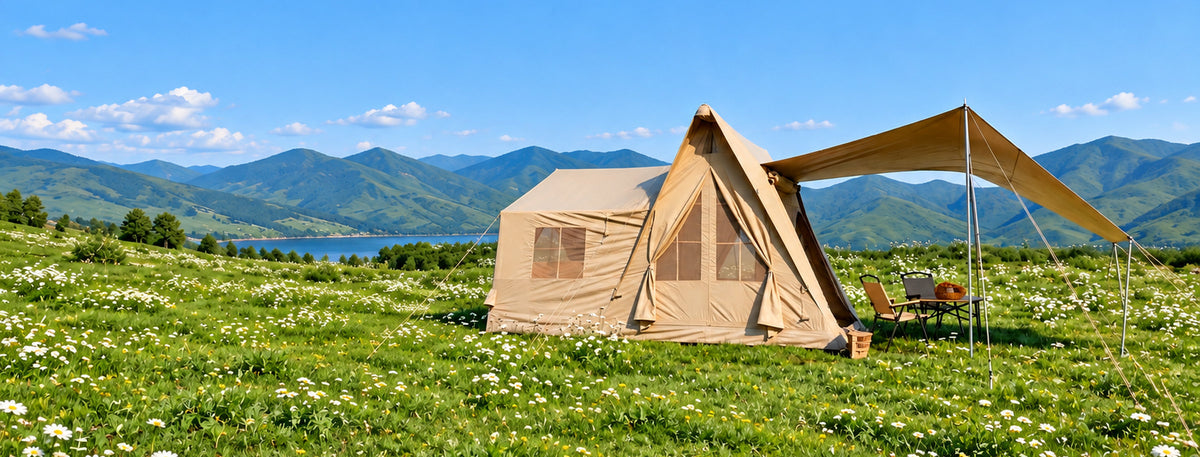Khaki A-Frame tent in a sunlit meadow camp.