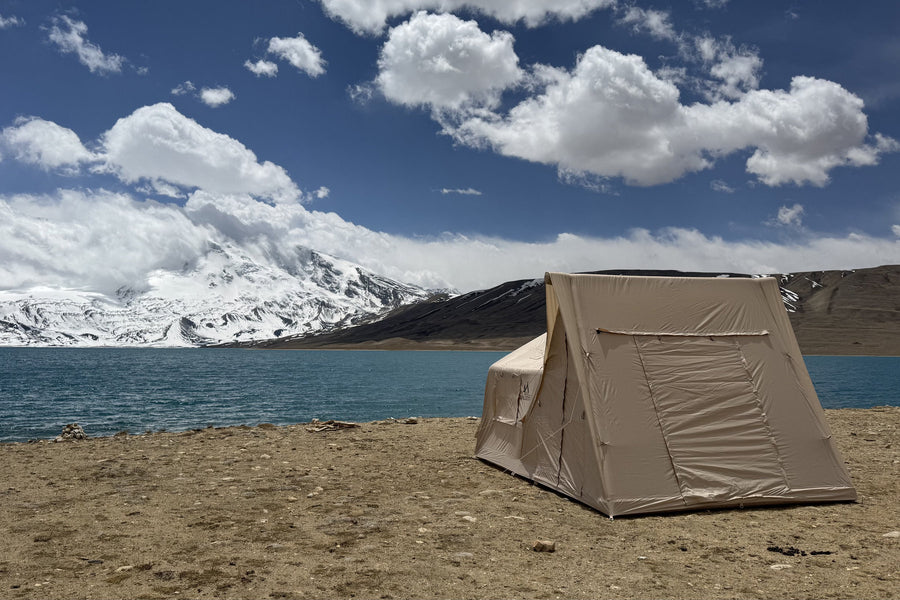 Khaki A-Frame camping photo: rear view beside the lake.