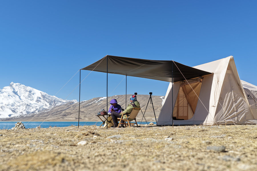 Khaki A-Frame camping photo: seating beneath the awning.