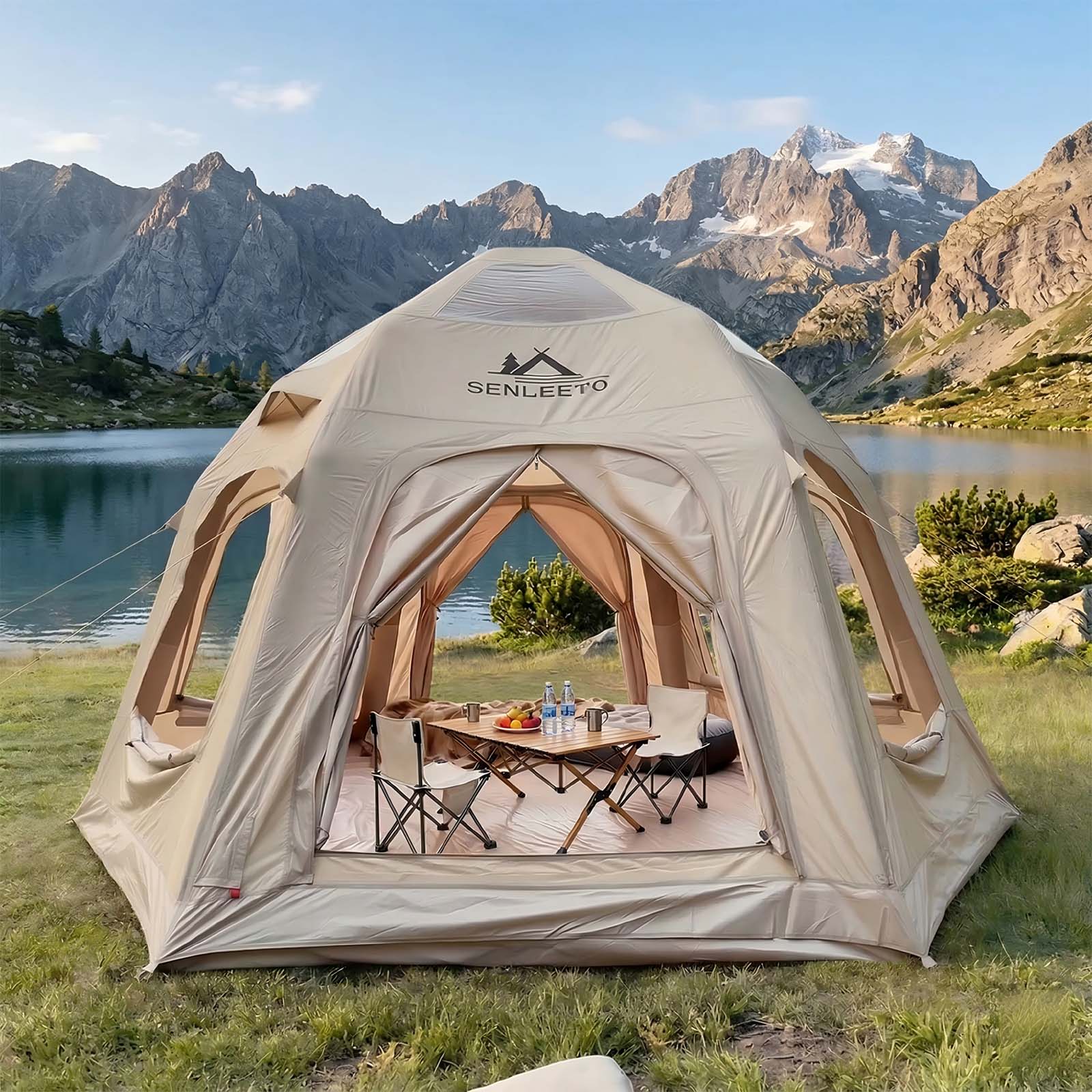 Beige Senleeto Halo Dome inflatable glamping tent by a mountain lake, featuring a spacious design and included canopy.