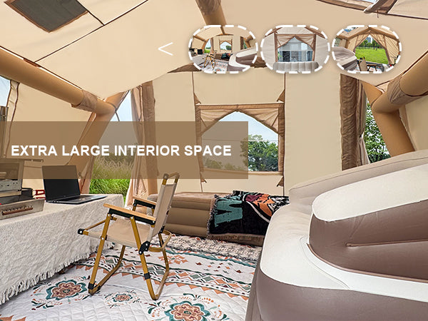 Spacious interior of Senleeto glamping tent with sofa, bed, and table.