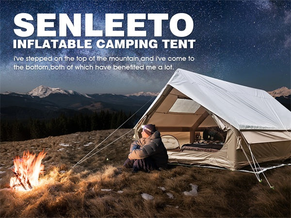 Senleeto inflatable camping tent set up outdoors at night under a starry sky, with a camper relaxing by a campfire.