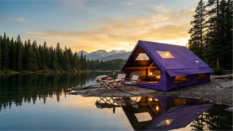 Senleeto purple luxury inflatable cabin tent set up on a rocky lakeshore at sunset.