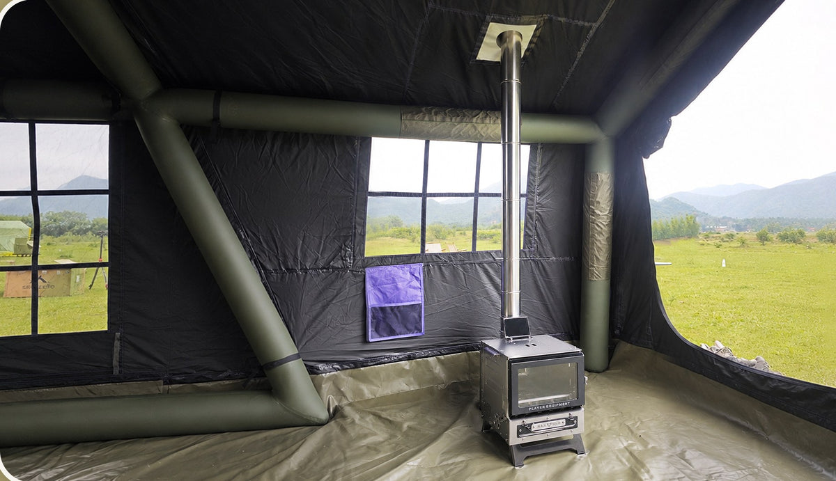 Wood stove pipe routed through the ceiling stove jack inside a Senleeto A-Frame tent