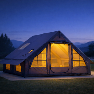 Purple inflatable glamping tent at dusk with warm interior lighting